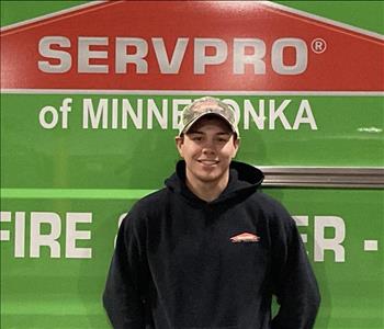 Male employee, crew leader in front of SERVPRO truck